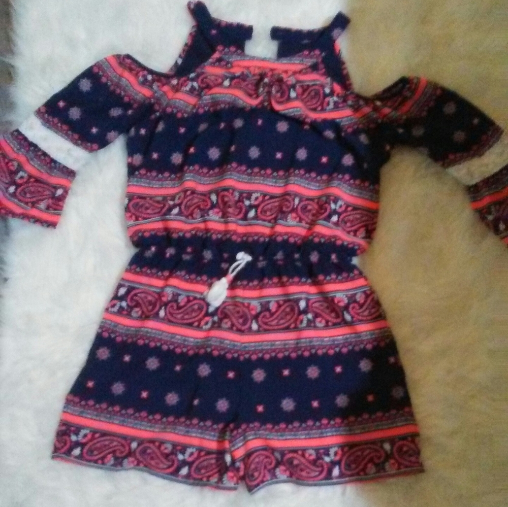 A dark blue and coral color romper
